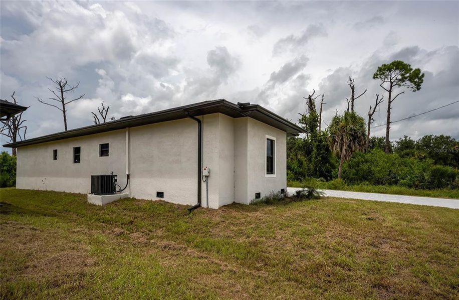Front exterior of a new home in , Rotonda West, FL, highlighting curb appeal (Image 24).