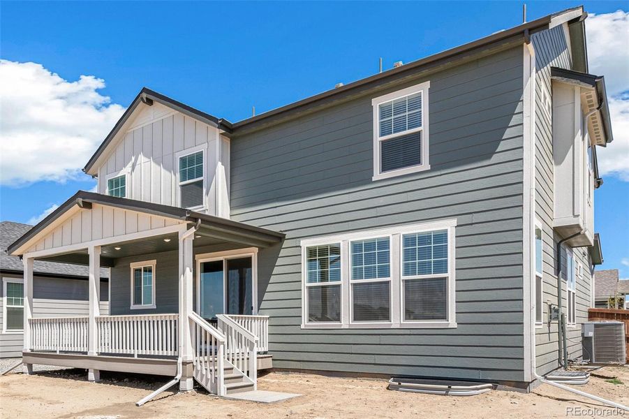 Front exterior of a new home in Farmlore, Brighton, CO, highlighting curb appeal (Image 21).