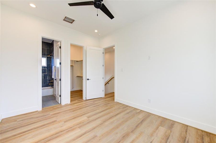 Bedroom 3 on 3rd floor across the hall from the primary. Features a walk-in closet and full bathroom.