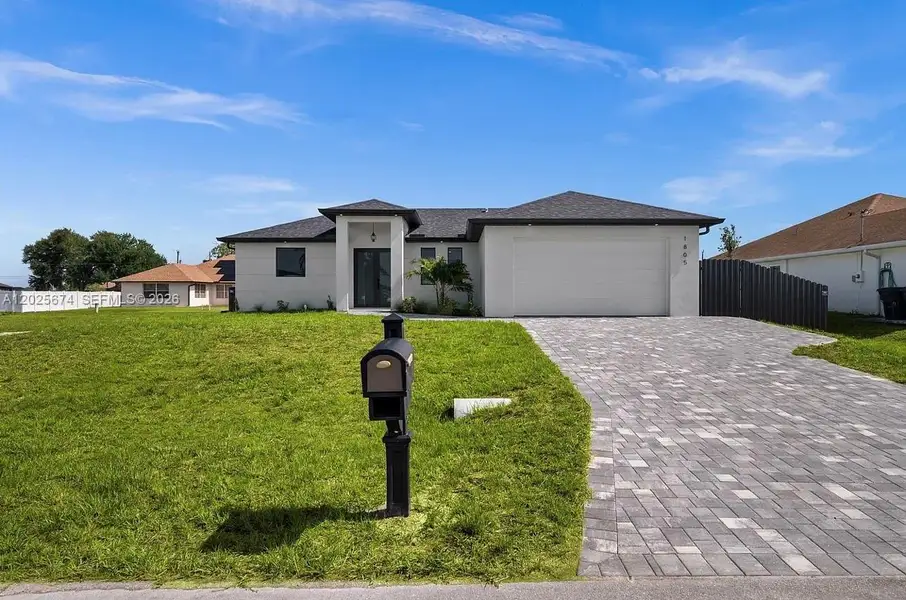 Front exterior of a new home in , Cape Coral, FL, highlighting curb appeal (Image 1). Front exterior of a new home in , Cape Coral, FL, highlighting curb appeal (Image 1).