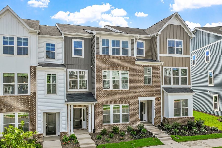 Front exterior of a new home in Renaissance at White Oak, Garner, NC, highlighting curb appeal (Image 2). Front exterior of a new home in Renaissance at White Oak, Garner, NC, highlighting curb appeal (Image 2).