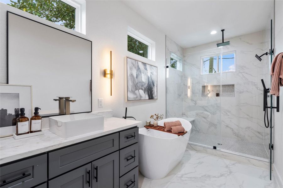 Oversized frameless glass shower with dual showerheads including a ceiling-mounted rain shower. Your own personal spa! Oversized frameless glass shower with dual showerheads including a ceiling-mounted rain shower. Your own personal spa!