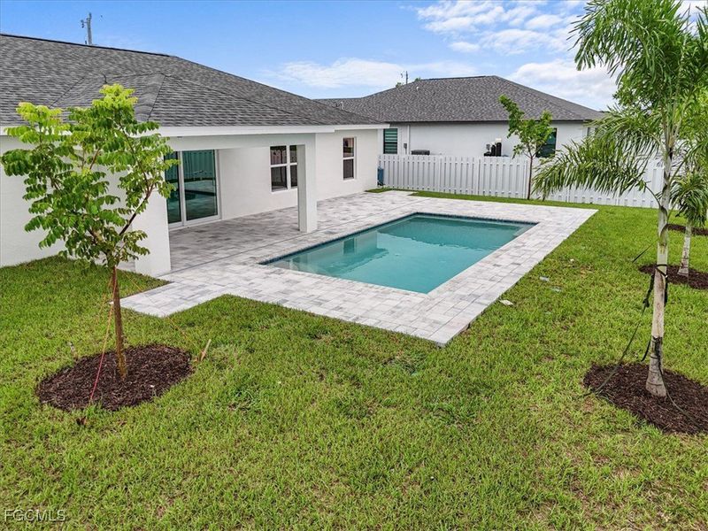 Front exterior of a new home in Cape Coral, Cape Coral, FL, highlighting curb appeal (Image 23). Front exterior of a new home in Cape Coral, Cape Coral, FL, highlighting curb appeal (Image 23).
