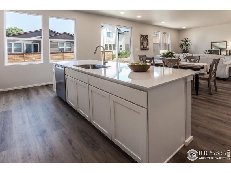 KITCHEN OPEN TO DINING AND LIVING ROOM (FURNITURE/DECOR NOT INCLUDED)