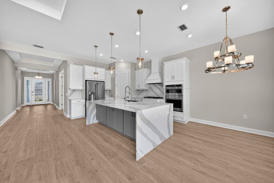 Furnished interior view inside a new home in Esplanade by the Islands, Naples (Image 5).