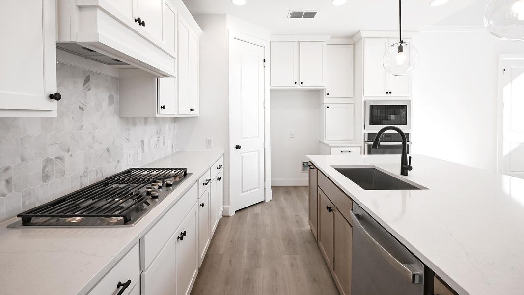 Furnished interior view inside a new home in Crosswinds 50', Kyle (Image 7).