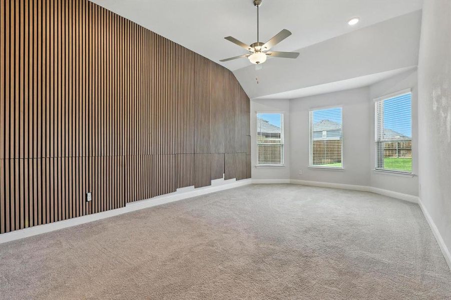 Large primary bedroom on first level with natural light!
