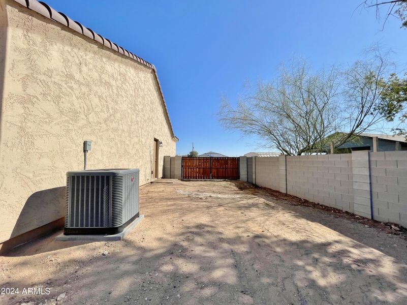 Side view of home RV gate and parking