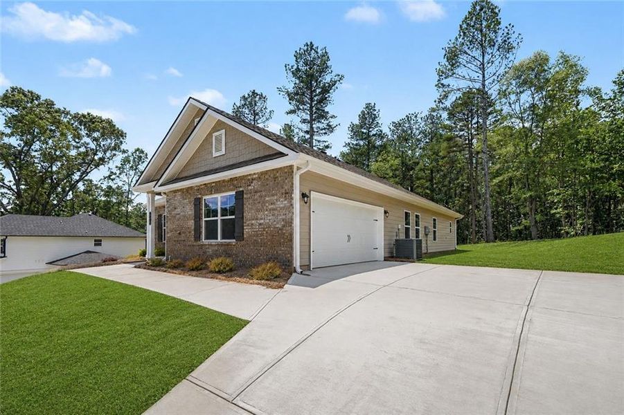 Front exterior of a new home in The Fields of Walnut Creek, Pendergrass, GA, highlighting curb appeal (Image 18). Front exterior of a new home in The Fields of Walnut Creek, Pendergrass, GA, highlighting curb appeal (Image 18).