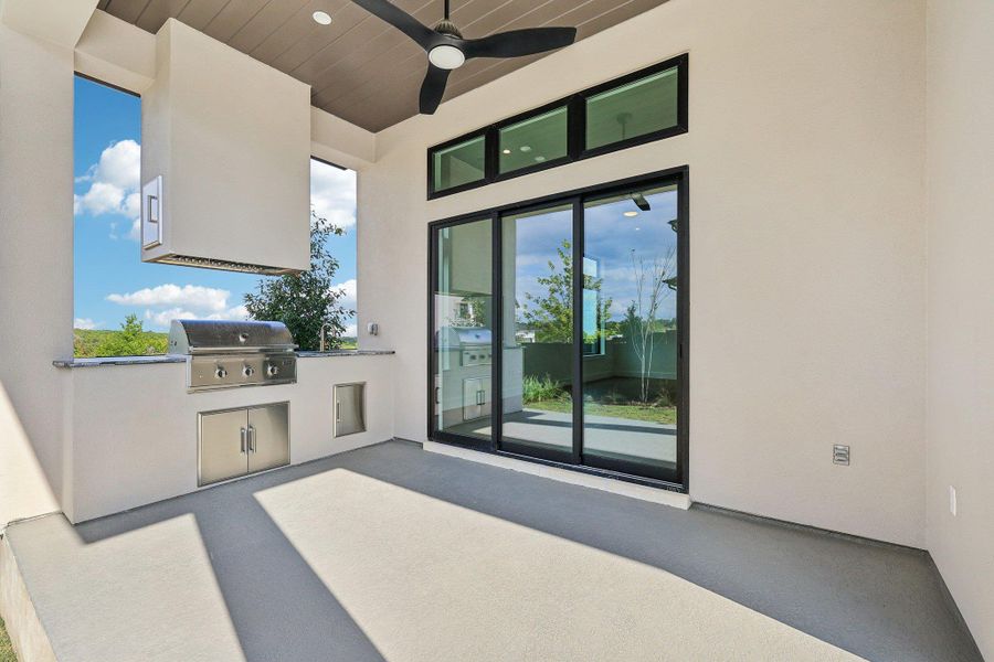 View of patio / terrace featuring exterior kitchen and ceiling fan