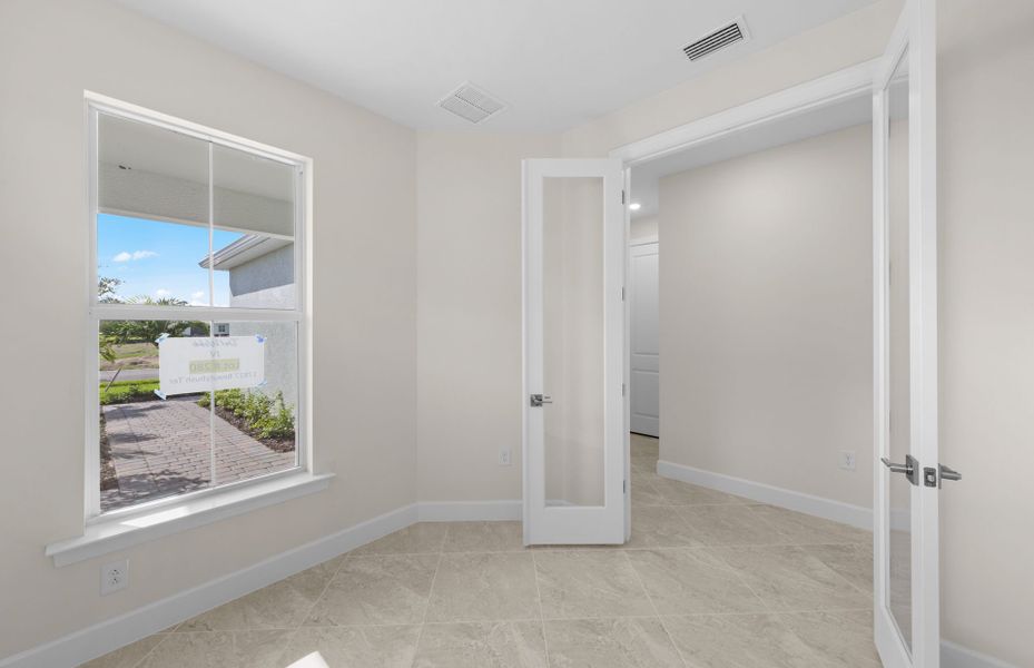 Enclosed flex room featuring elegant French doors