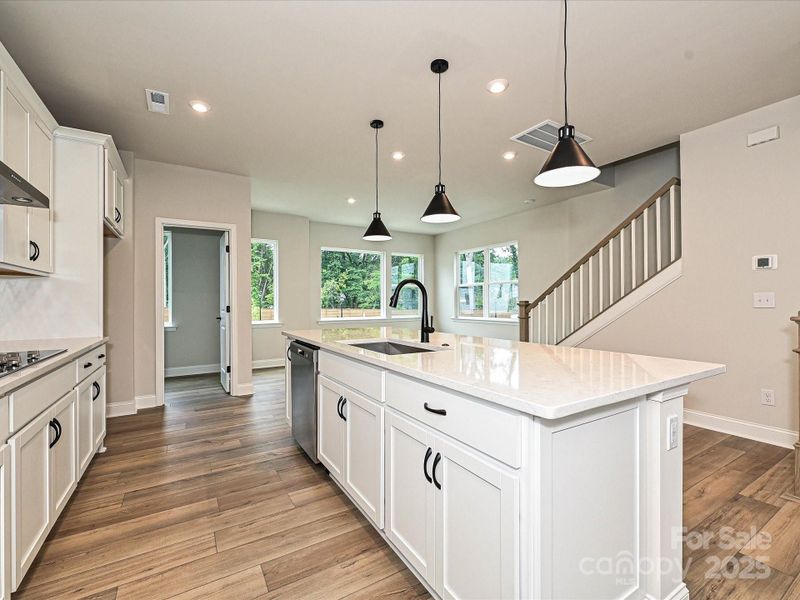 Large Central Island Packed with Storage and Ideal for Casual Dining.