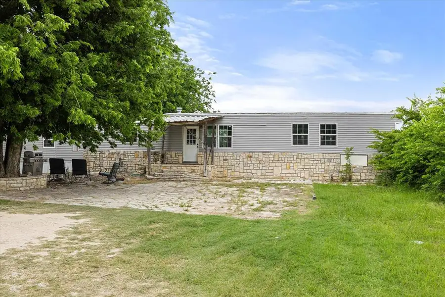 Exterior details and patio area of a home in , Glen Rose (Image 2). Exterior details and patio area of a home in , Glen Rose (Image 2).