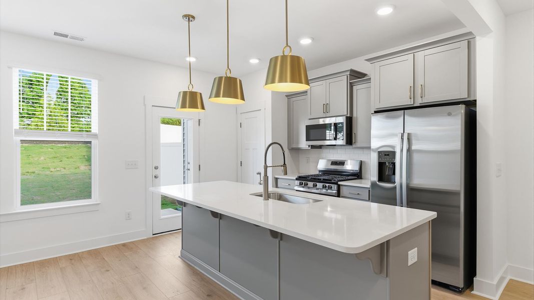 Accomplished design in a kitchen that blends function and form with a right-sized island located in Anderson, SC