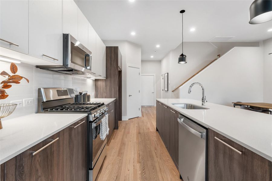 quipped with stainless steel appliances, a spacious walk-in pantry & soft-close drawers, this kitchen blends everyday convenience with sleek, modern design. quipped with stainless steel appliances, a spacious walk-in pantry & soft-close drawers, this kitchen blends everyday convenience with sleek, modern design.