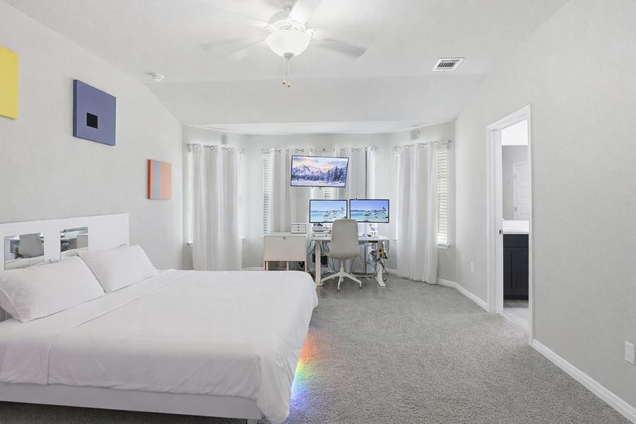 The primary suite is tucked at the rear for maximum privacy.