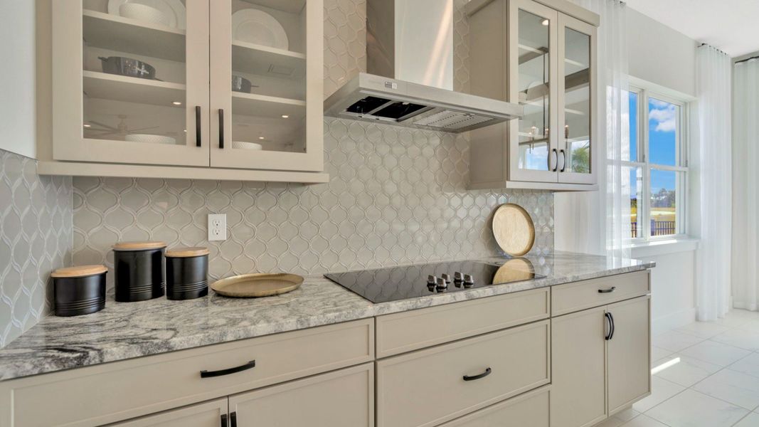 The Kitchen of a DRB Homes Grand Eider model, which is a home plan offered at Serengeti in Spring Hill, FL.