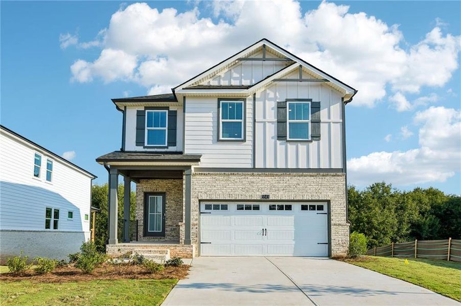 Front exterior of a new home in Hemingway - Reserve Series, Cumming, GA, highlighting curb appeal (Image 26). Front exterior of a new home in Hemingway - Reserve Series, Cumming, GA, highlighting curb appeal (Image 26).