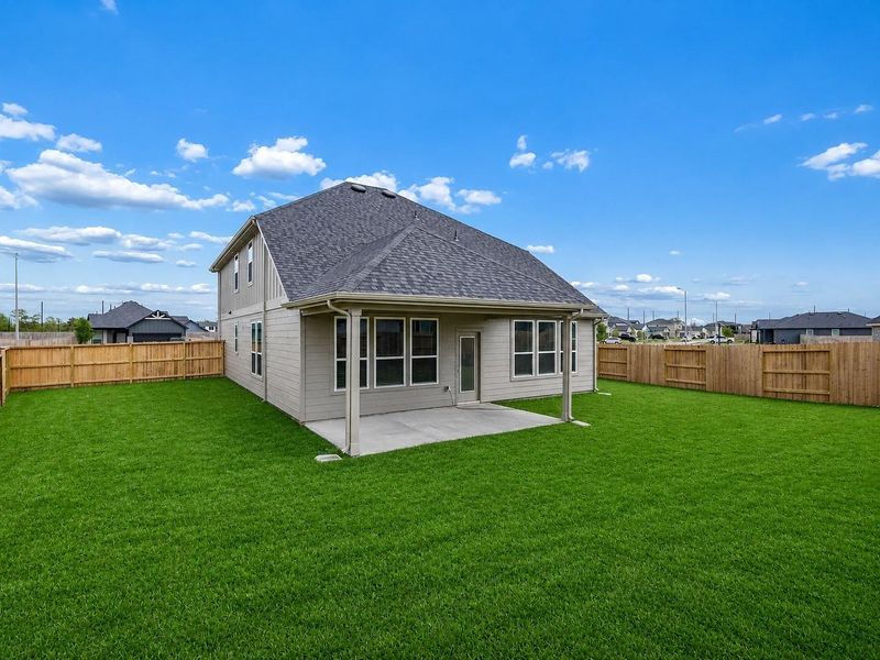 Exterior details and patio area of a home in Windcress, Cove (Image 18).