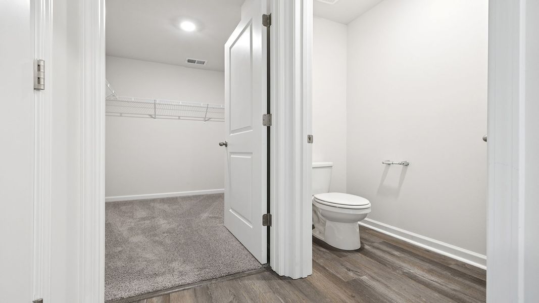 Spacious, unfurnished interior of a new home in Bentley Park, Greenwood (Image 29).