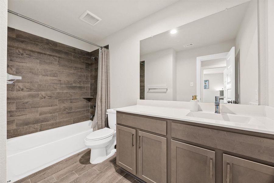 Furnished interior view inside a new home in Sunterra, Katy (Image 10).