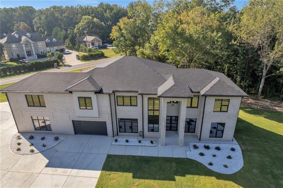 Front exterior of a new home in , Lawrenceville, GA, highlighting curb appeal (Image 24). Front exterior of a new home in , Lawrenceville, GA, highlighting curb appeal (Image 24).