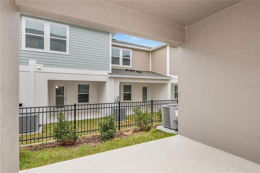 Exterior details and patio area of a home in Grove at Crosswind, Haines City (Image 2).
