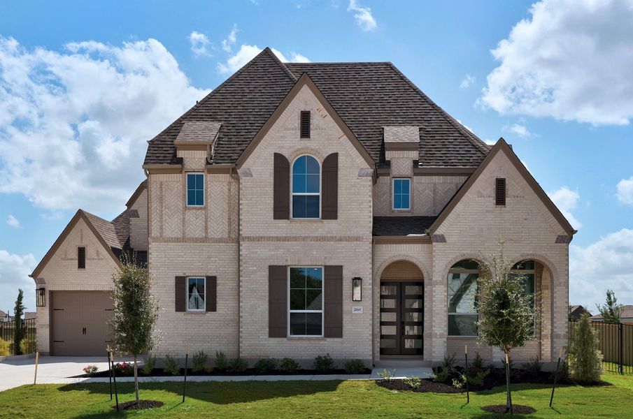 Front exterior of a new home in Santa Rita Ranch, Liberty Hill, TX, highlighting curb appeal (Image 1). Front exterior of a new home in Santa Rita Ranch, Liberty Hill, TX, highlighting curb appeal (Image 1).