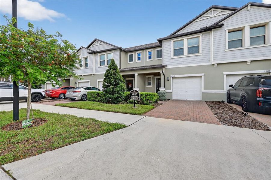 Front exterior of a new home in , Land O' Lakes, FL, highlighting curb appeal (Image 1).