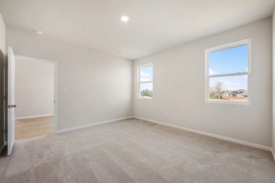 Spacious, unfurnished interior of a new home in The Colony, Bastrop (Image 34).