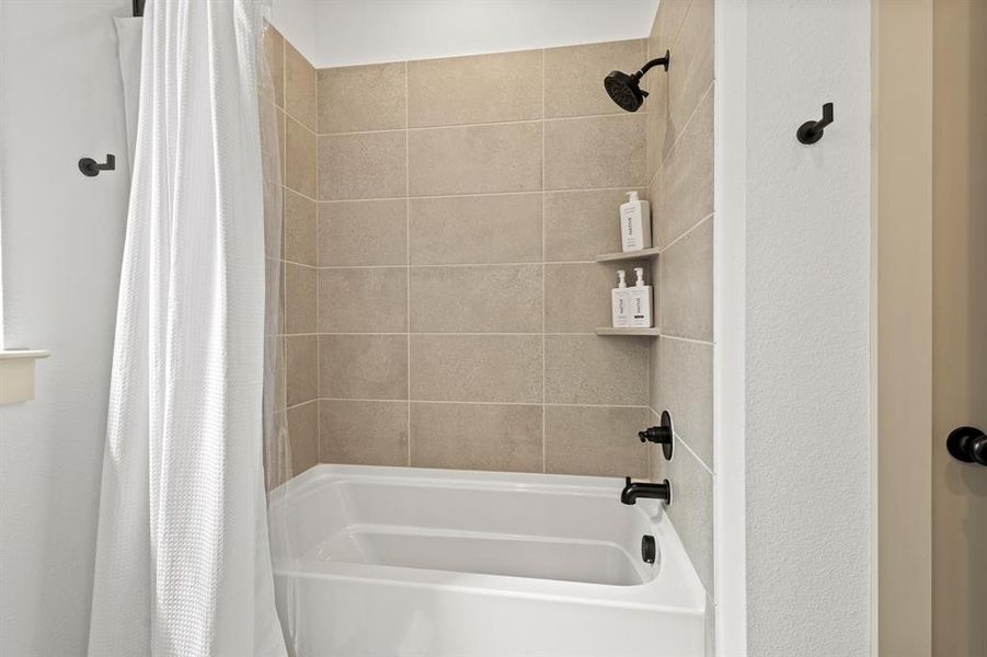 Bathroom with shower / bath combo with shower curtain