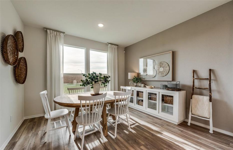 Bright dining nook off of kitchen *Real Home pictured, former model.