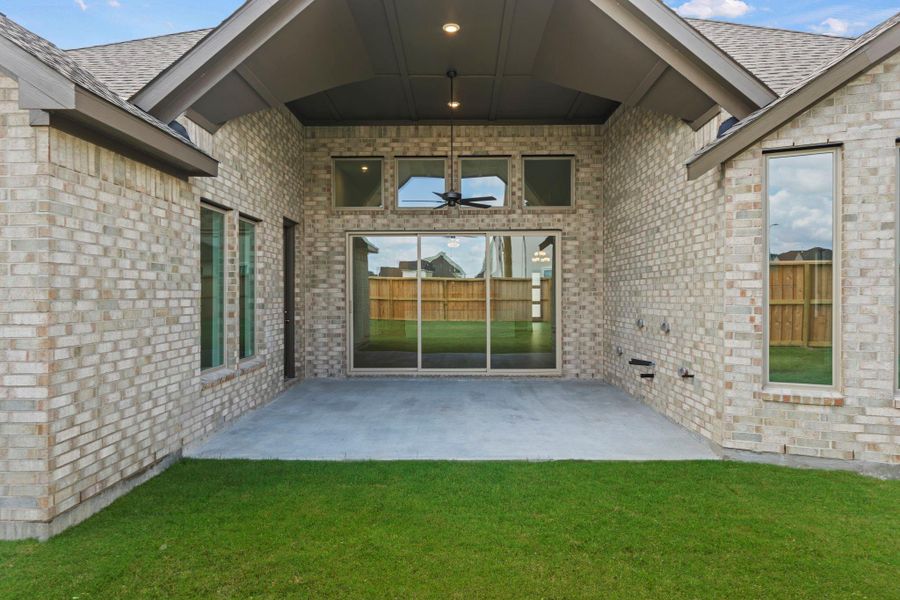 Exterior details and patio area of a home in Dunham Pointe, Cypress (Image 4). Exterior details and patio area of a home in Dunham Pointe, Cypress (Image 4).