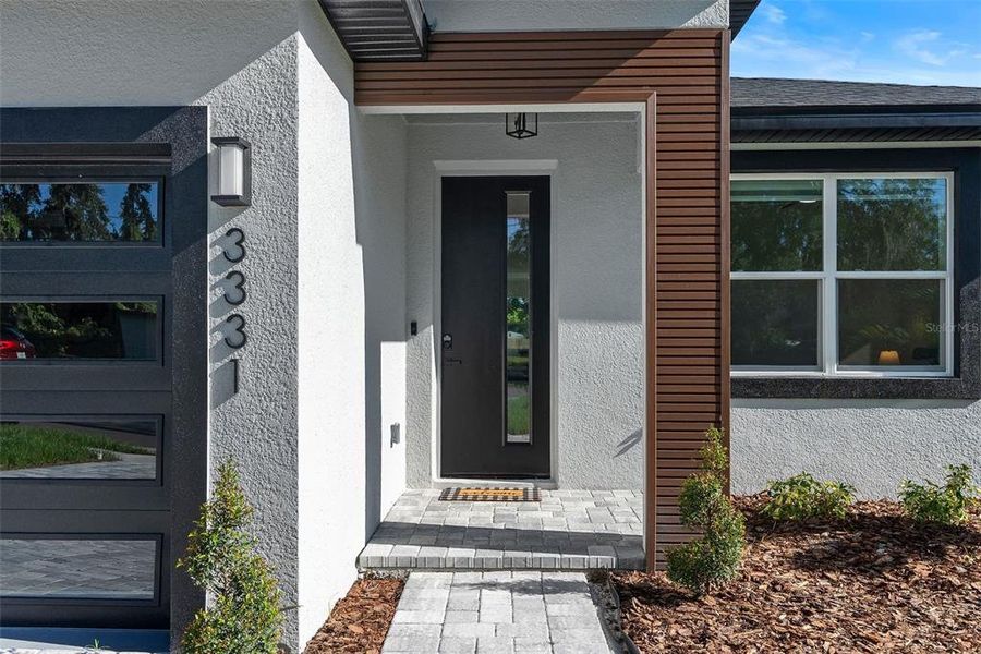 Front exterior of a new home in , Orlando, FL, highlighting curb appeal (Image 19).