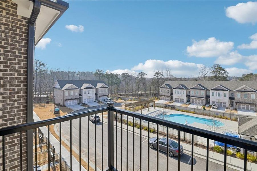 Exterior details and patio area of a home in Ward's Crossing Townhomes, Johns Creek (Image 21).