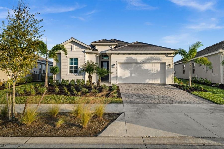 Front exterior of a new home in , Punta Gorda, FL, highlighting curb appeal (Image 21).