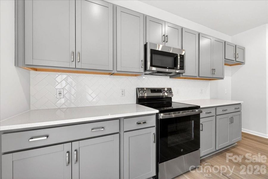 Striking 3x6 Arctic White Gloss backsplash installed in a vertical herringbone pattern Striking 3x6 Arctic White Gloss backsplash installed in a vertical herringbone pattern