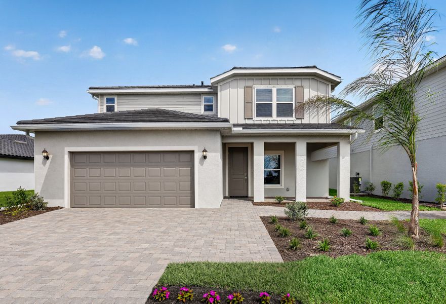 Front exterior of a new home in Gatherpoint, Ave Maria, FL, highlighting curb appeal (Image 1). Front exterior of a new home in Gatherpoint, Ave Maria, FL, highlighting curb appeal (Image 1).