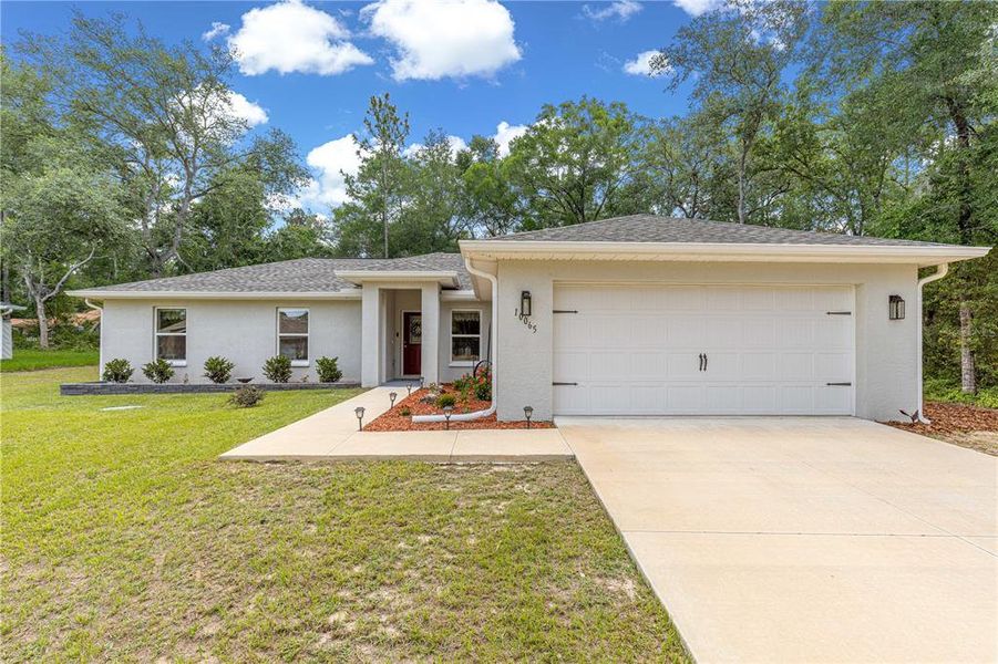Front exterior of a new home in , Citrus Springs, FL, highlighting curb appeal (Image 21).
