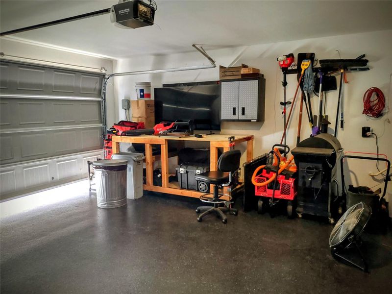 Garage featuring a garage door opener