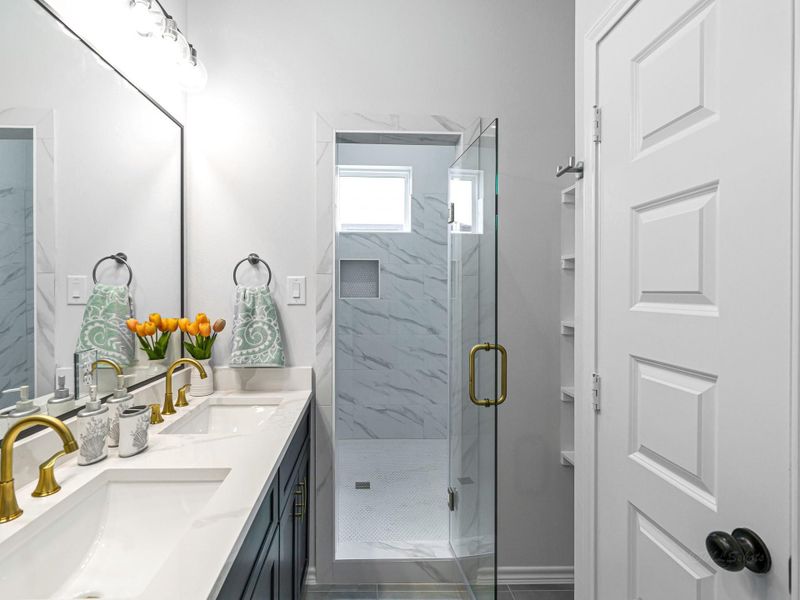 Double vanities and lots of space to share. Nice built in shelves