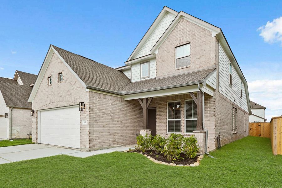 Front exterior of a new home in Huntington Place, Rosharon, TX, highlighting curb appeal (Image 2). Front exterior of a new home in Huntington Place, Rosharon, TX, highlighting curb appeal (Image 2).
