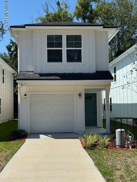 Front exterior of a new home in , Jacksonville, FL, highlighting curb appeal (Image 1).