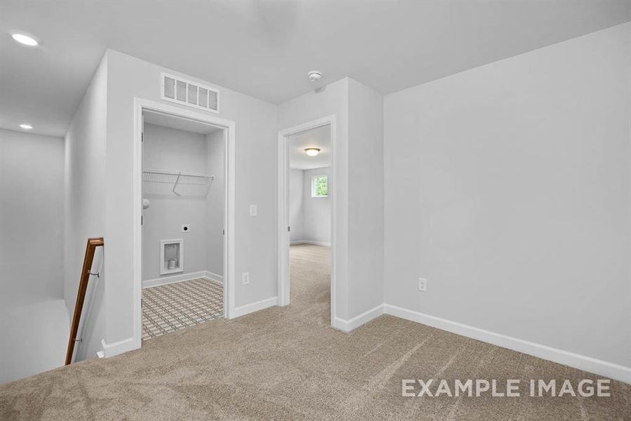 Empty room featuring carpet flooring