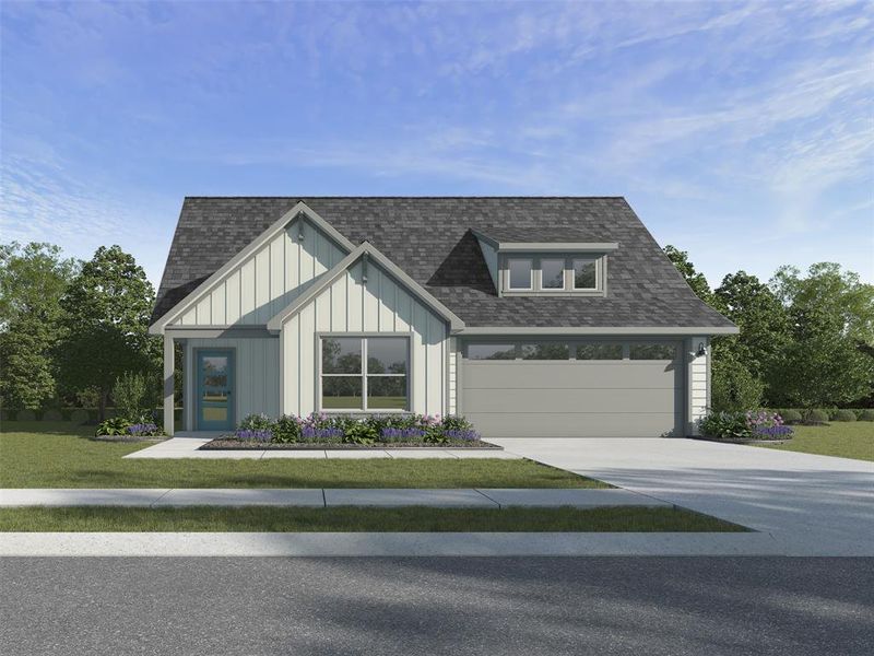 View of front of property with a garage and a front lawn