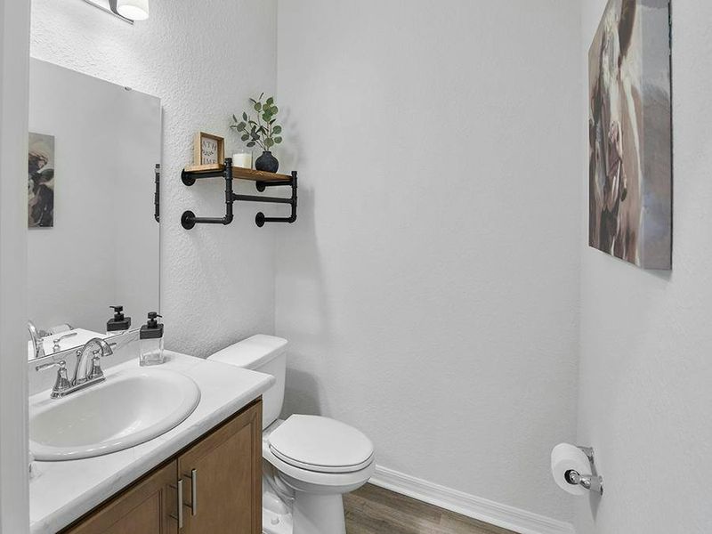 This home also includes a convenient powder room for guests - Summerlyn II by Highland Homes