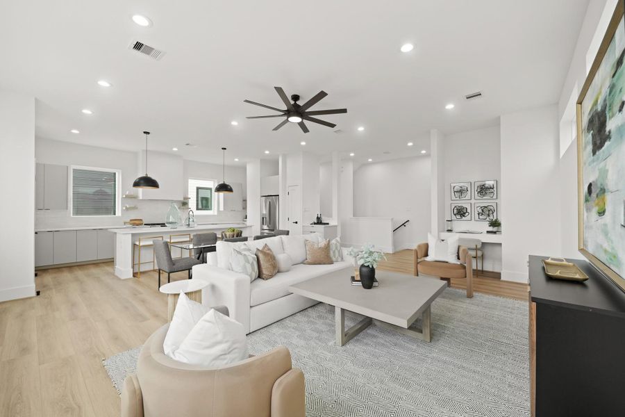 The 10-foot ceilings give the living areas an unmatched feeling of space as the family room and formal dining room feed into the island kitchen with breakfast bar seating.