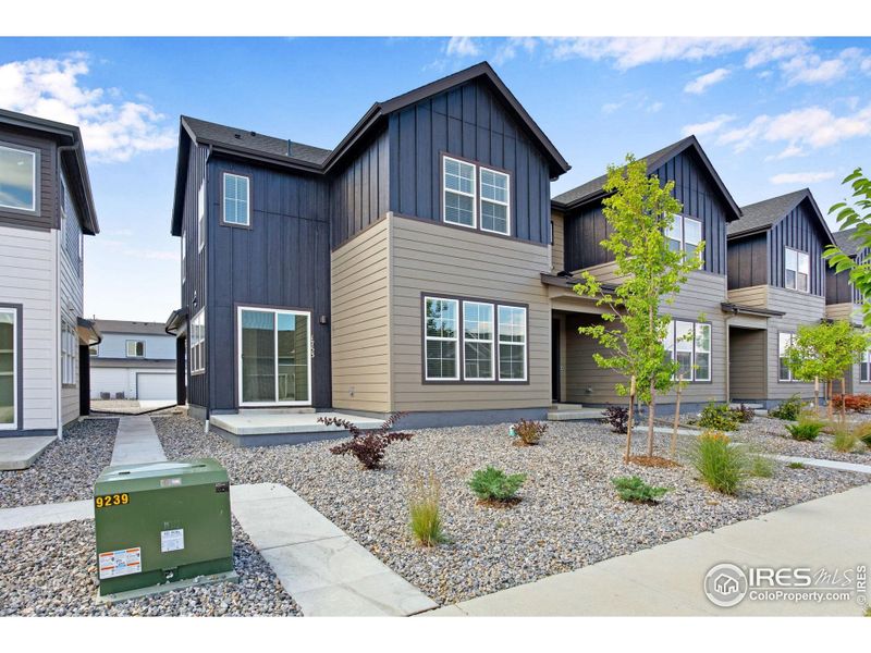 Front exterior of a new home in Westside Crossing Townhomes, Berthoud, CO, highlighting curb appeal (Image 23).