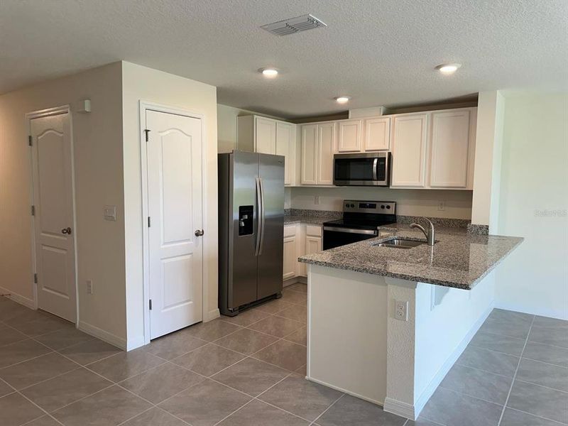Furnished interior view inside a new home in , St. Cloud (Image 5).