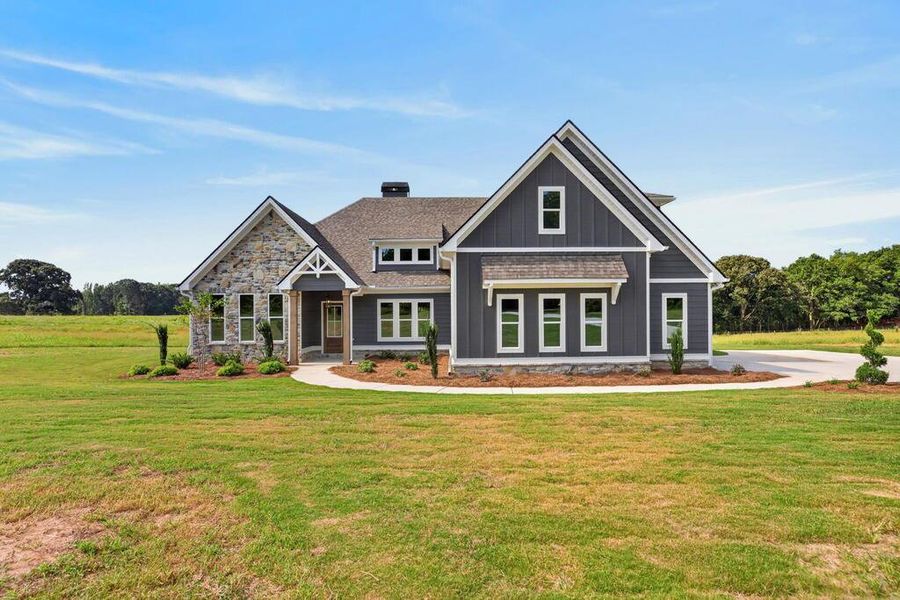 Front exterior of a new home in Veal Meadows, Roopville, GA, highlighting curb appeal (Image 1). Front exterior of a new home in Veal Meadows, Roopville, GA, highlighting curb appeal (Image 1).